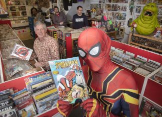 Spiderman drops in at Rhyl Comic and Disc Co to meet, from left, owner and comic expert Stuart Stevenson and staff members Shaun Johnson and Tom Ellis.